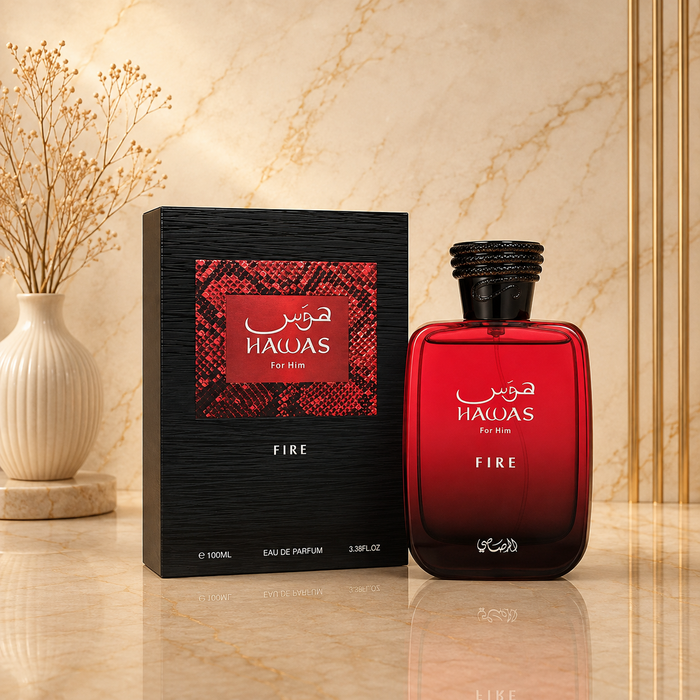 Hawas Fire de Rasasi con caja, fondo mármol beige